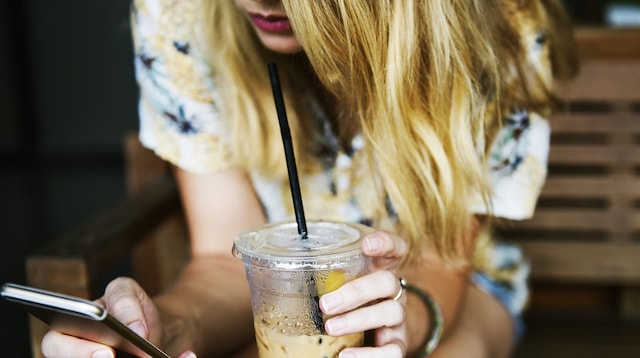 Social Media Platforms Young Woman Looking at Phone