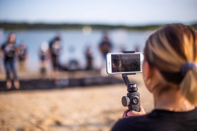 Woman recording video on an iPhone