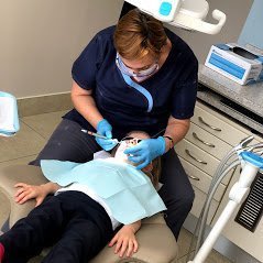 Dentist working on patient in Burlington office