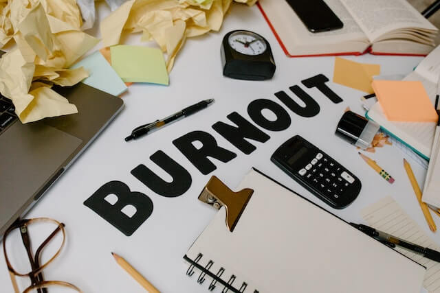 Desk with the word burnout