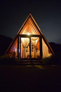 Glamping A-frame at night