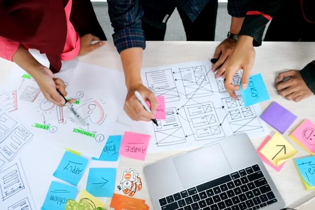 User interface designers working together at a table