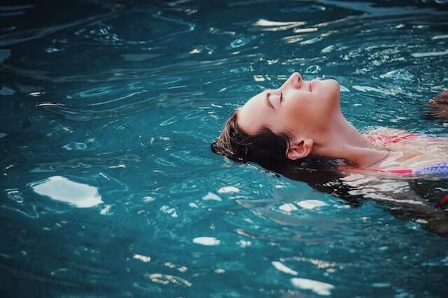 Woman floating on her back