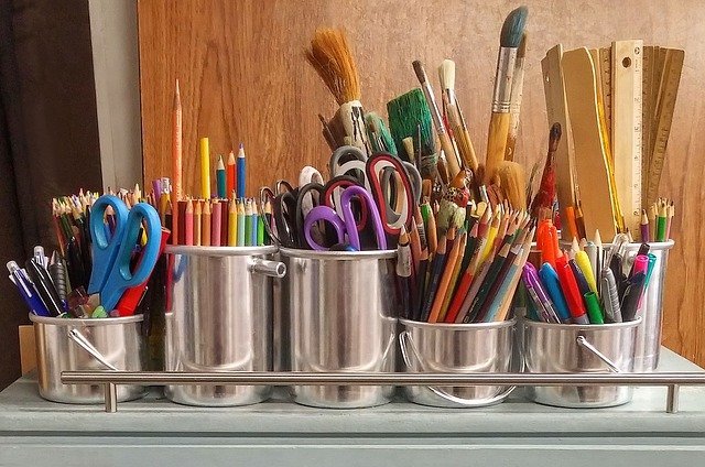 Art supplies in silver containers