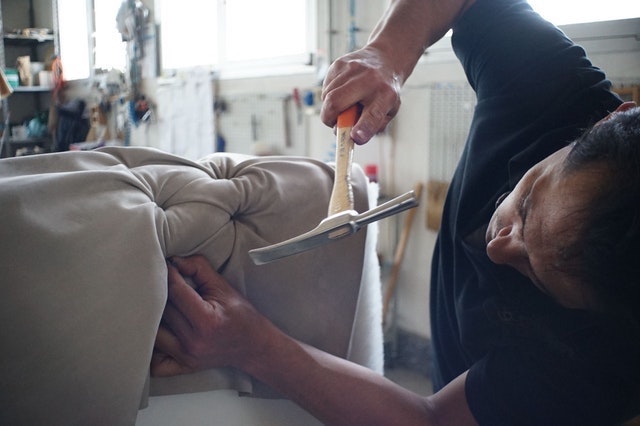 Business Loan Man Upholstering a Chair