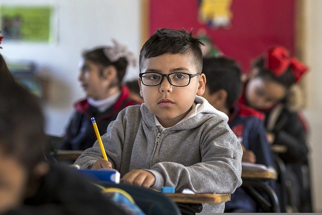 Child sitting at a school desk