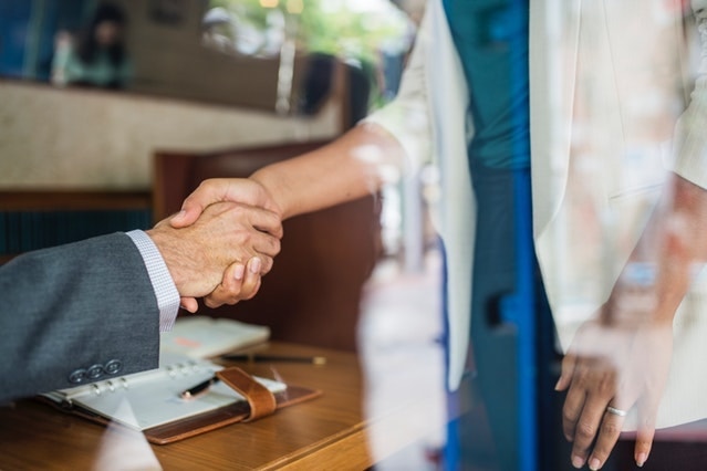 Classified Balance Sheet Woman and Man Shaking Hands