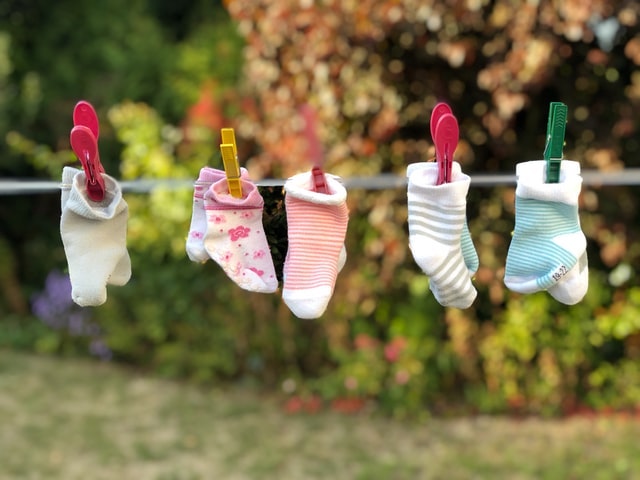 Closeline with pairs of baby socks clipped to it