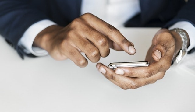 Closeup of a person typing something into their phone