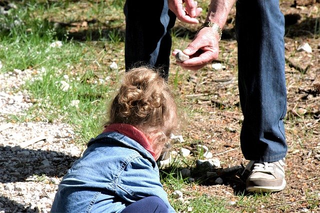 Grandpa outside with his granddaughter