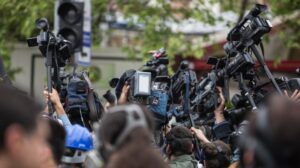 Group of journalists at an outdoor event