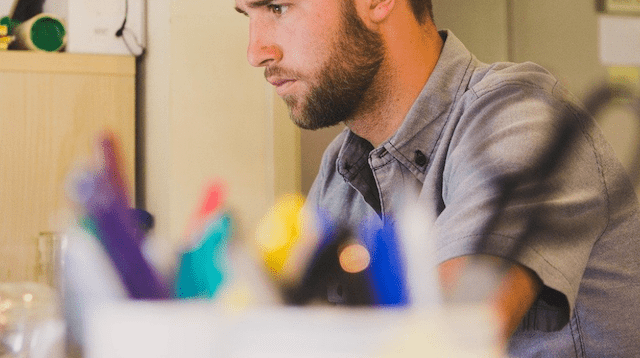 Man sitting at desk doing his taxes