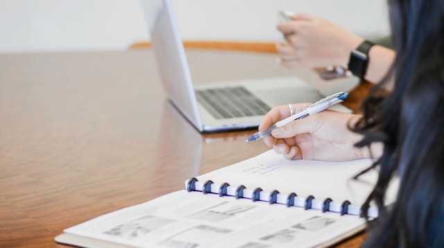 Marketing Strategy Woman with Notebook