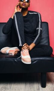 Model wearing a grey track suit