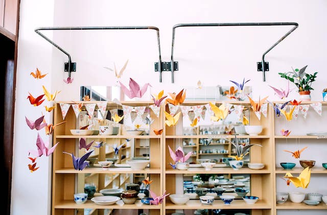 Origami cranes hanging inside an art shop