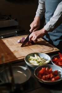 Person chopping vegetables on a cutting board