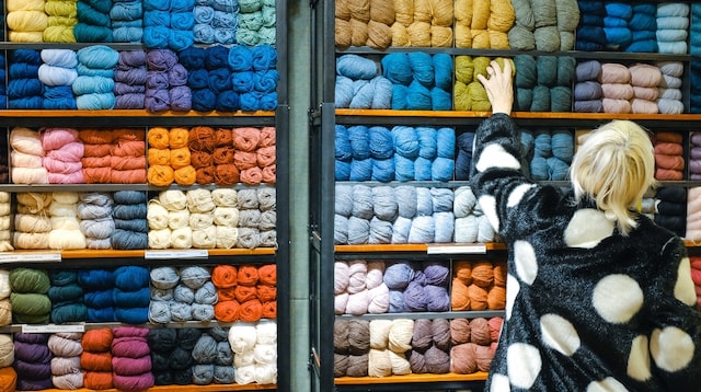 Sell a Business Woman Looking at Yarn Display