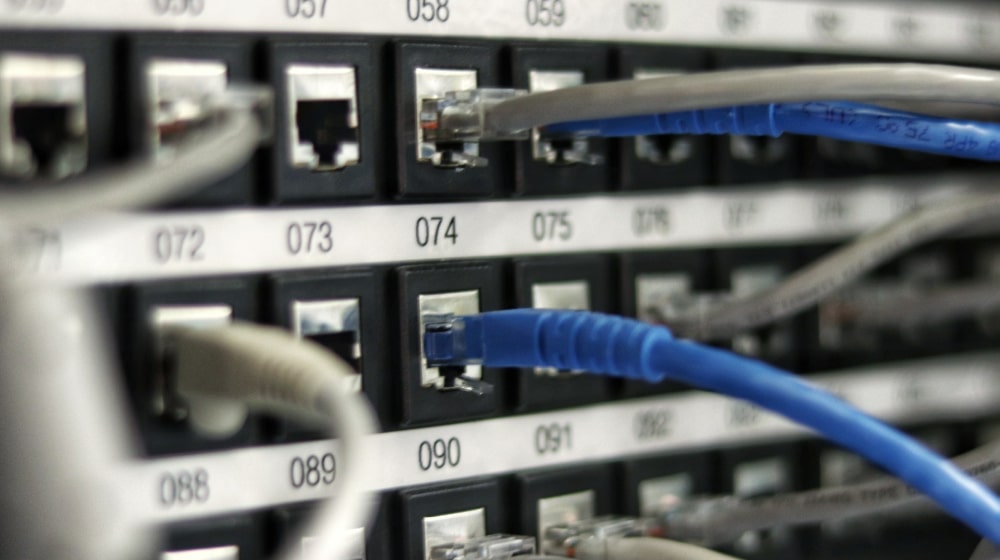 Closeup of server cables in a web hosting centre