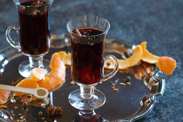 Two glasses of muulled wine on a silver tray