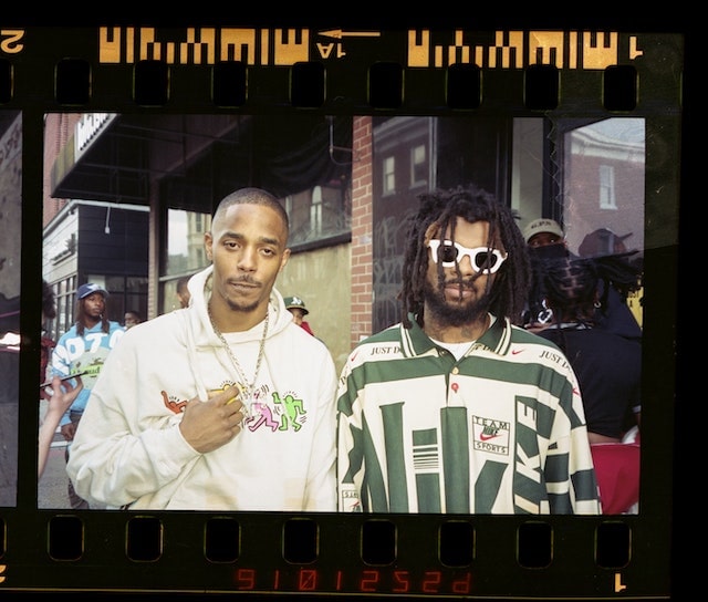 Two men posing in sports apparel