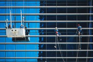 Window washers cleaning high rise windows