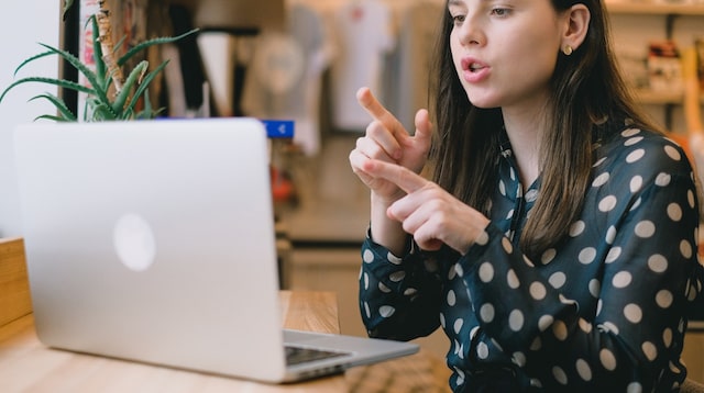 Woman talking with teammates online