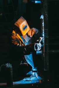 Steel worker wearing protective face shield