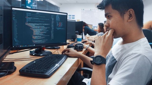 Bookkeeping Services Person Working at Computer