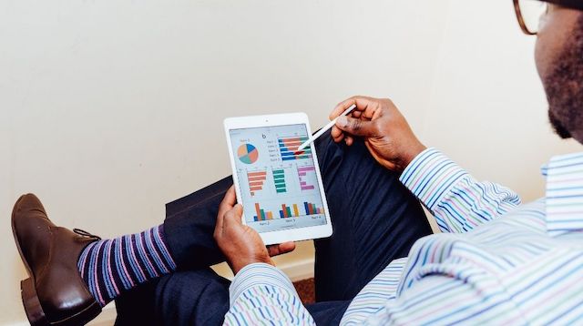 Business Finance Man Using Tablet