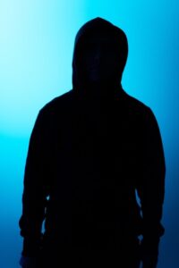 Dark Outline of Person Wearing a Hoodie