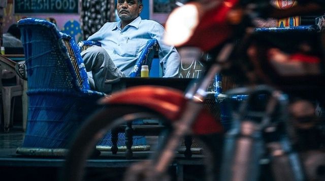 Electronic Payment System Man Sitting at Table