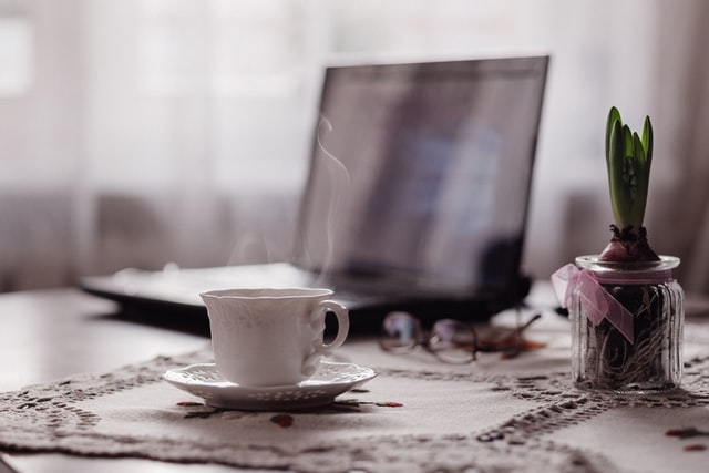 Helping Your Clients Desk with Laptop and Teacup