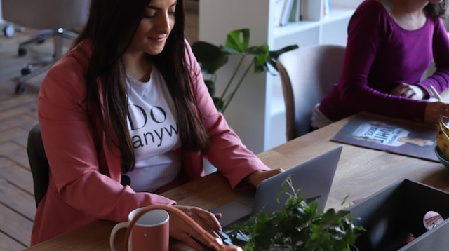 Payroll Software Two Women Working at Table