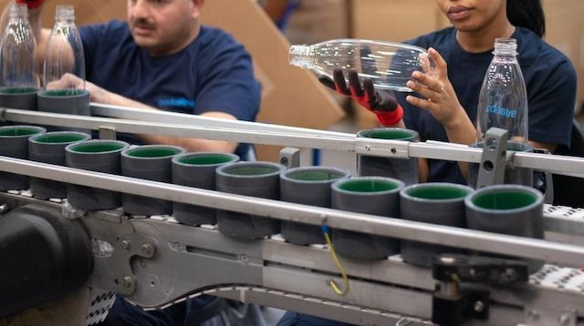 People Working on Production Line in Bottle Factory