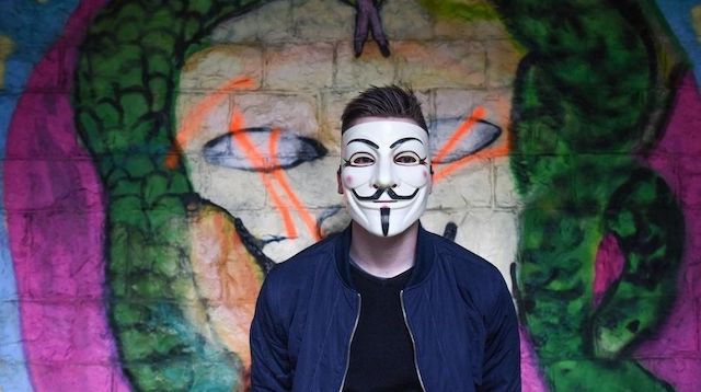 Person Wearing the Anonymous Hacker Mask