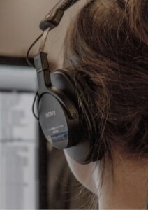 PHP Web Development Woman Coder with Headphones