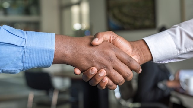 What is CRM Software Two Men Shaking Hands