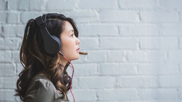 Woman Wearing a Phone Headset