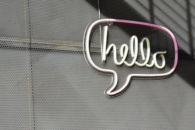 Marquee signs with the word “hello” written in cursive