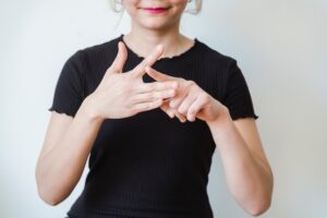 A person doing sign language