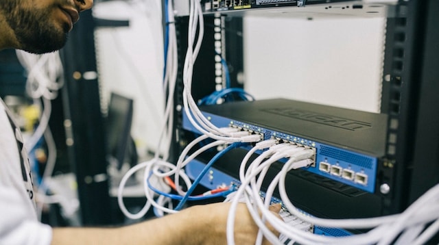 Business Process Outsourcing Man Installing Hardware