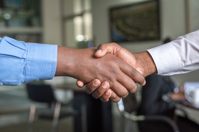 Close-up of two people shaking hands