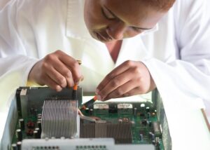 Closeup of a femail worker examining a motherboard