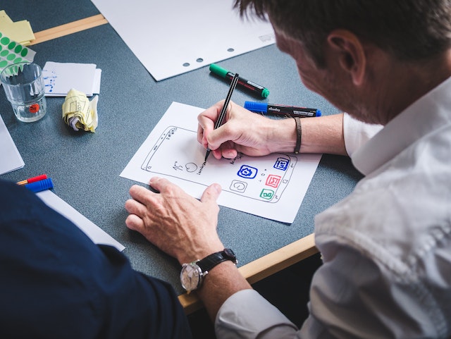 Developer sketching a mobile user interface