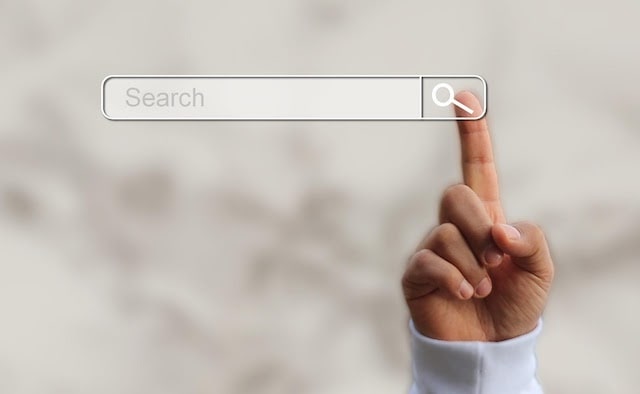 Finger pointing at the search bar