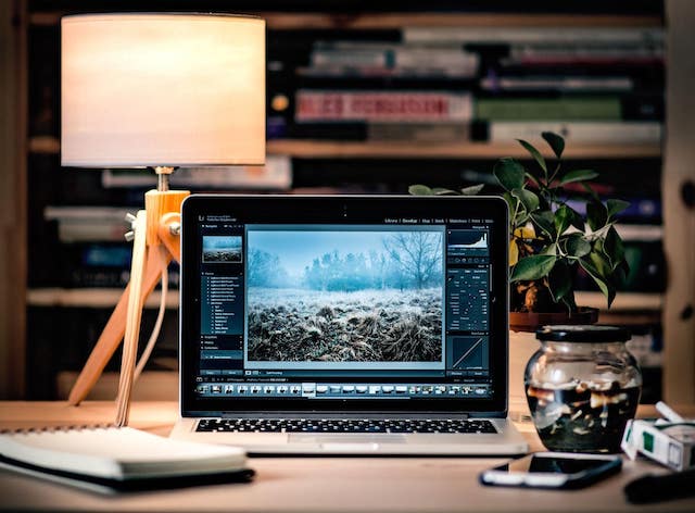 Laptop displaying colorful photo on screen