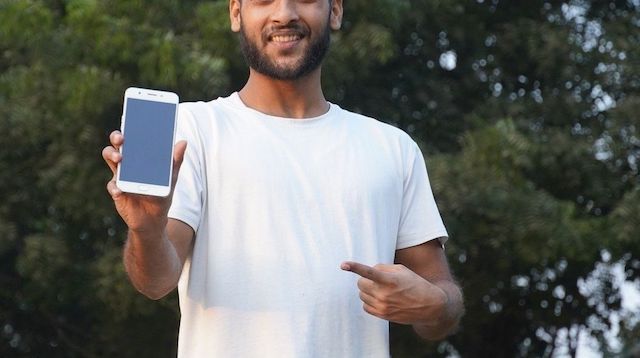 Man pointing to his mobile phone