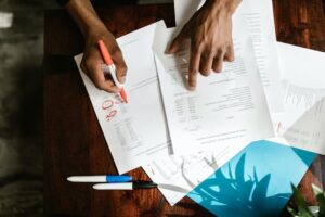 Overhead view of person working on business reports