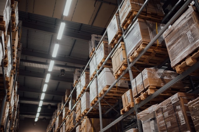 Pallets of boxes stacked on warehouse shelves