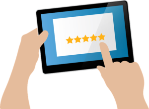 Person providing a rating on a digital tablet